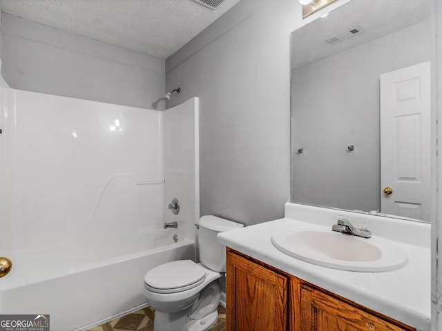 full bathroom with  shower combination, vanity, a textured ceiling, and toilet