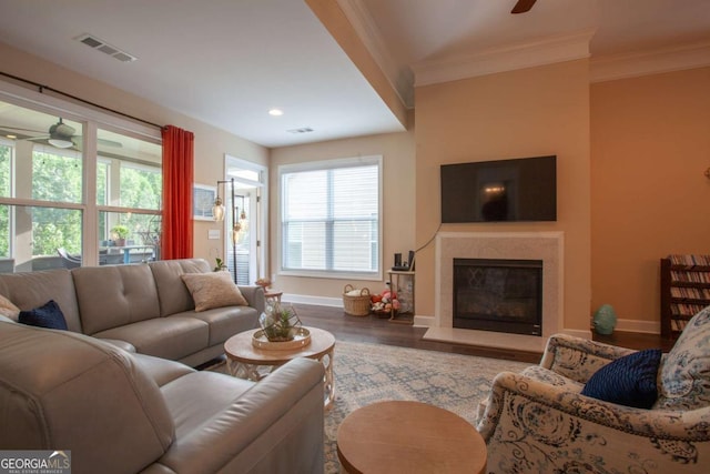 living room with ceiling fan, hardwood / wood-style floors, and ornamental molding