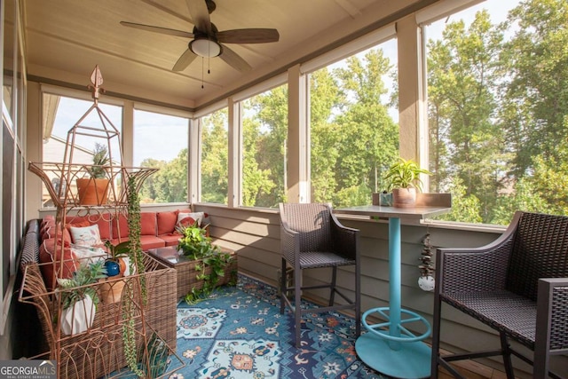 sunroom / solarium with ceiling fan