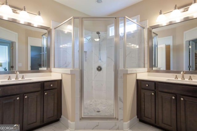 full bathroom with vanity, a shower stall, and marble finish floor