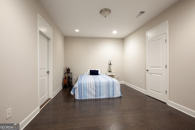 unfurnished bedroom featuring recessed lighting, visible vents, baseboards, and wood finished floors