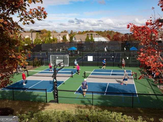 view of tennis court with fence