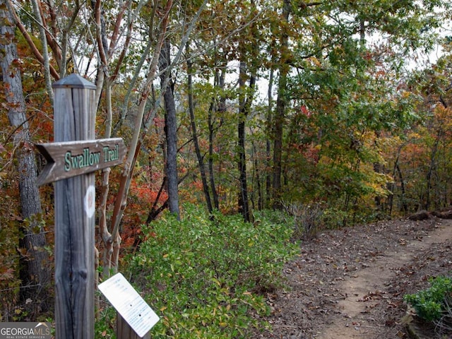 exterior space featuring a wooded view