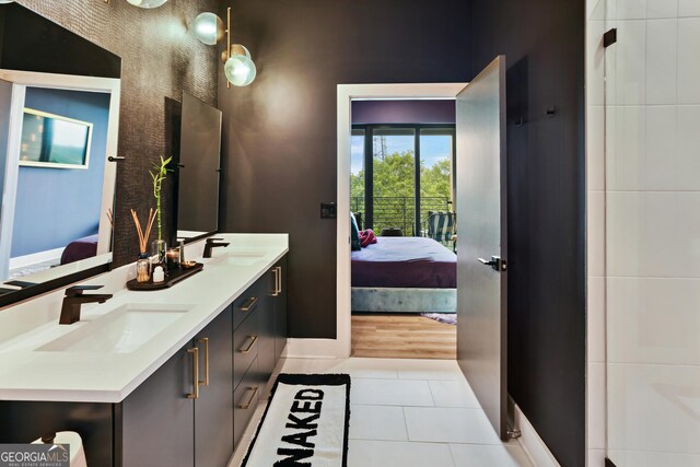 bathroom with tile patterned floors and vanity