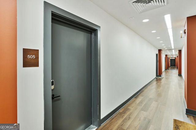 hall featuring light hardwood / wood-style floors