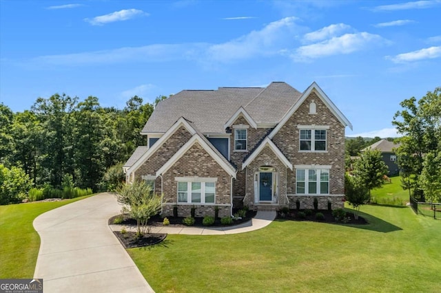 craftsman inspired home with a front lawn