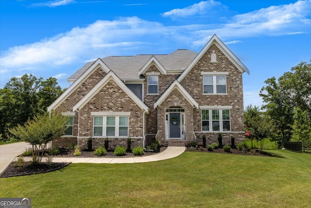 craftsman-style home with a front lawn