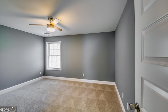 carpeted empty room with ceiling fan