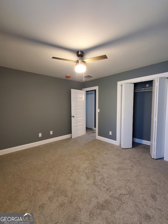 unfurnished bedroom with carpet flooring and ceiling fan