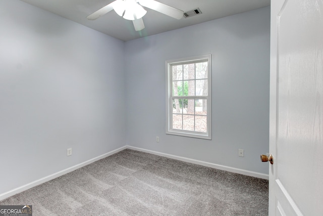 empty room featuring carpet and ceiling fan