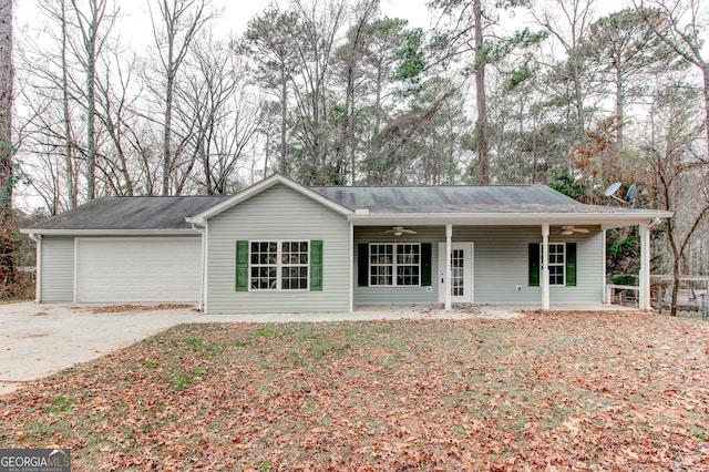 single story home with ceiling fan, a porch, and a garage