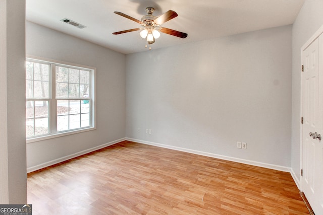 spare room featuring light hardwood / wood-style floors and ceiling fan