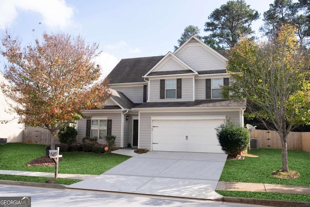 craftsman-style house featuring cooling unit, a front yard, and a garage