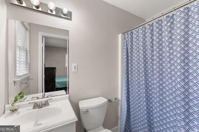 bathroom with vanity and toilet