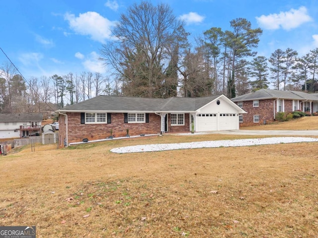 ranch-style home featuring a garage and a front lawn