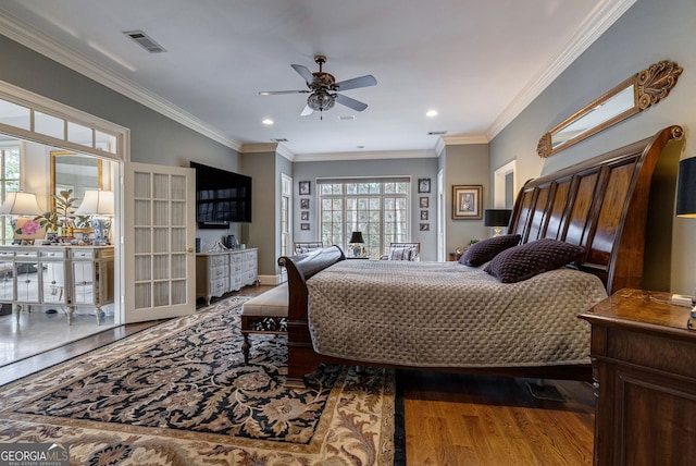 bedroom with hardwood / wood-style floors, french doors, ceiling fan, and ornamental molding