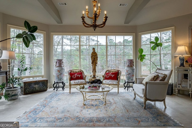 sunroom featuring beamed ceiling and a notable chandelier