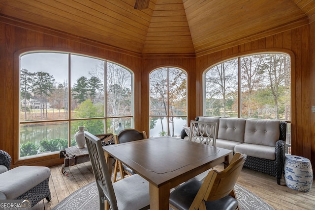 sunroom / solarium with a water view, wood ceiling, and lofted ceiling