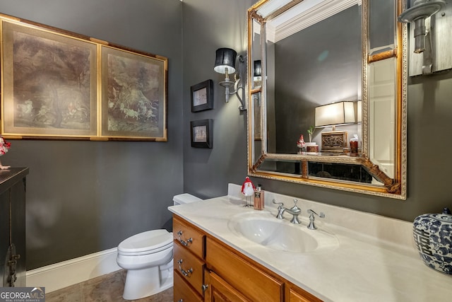 bathroom featuring tile patterned floors, vanity, and toilet