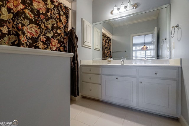 bathroom with tile patterned floors, vanity, and ornamental molding