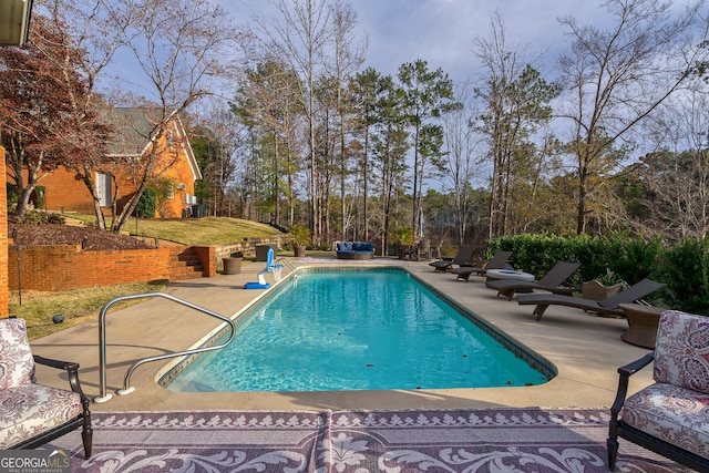 view of pool with a patio