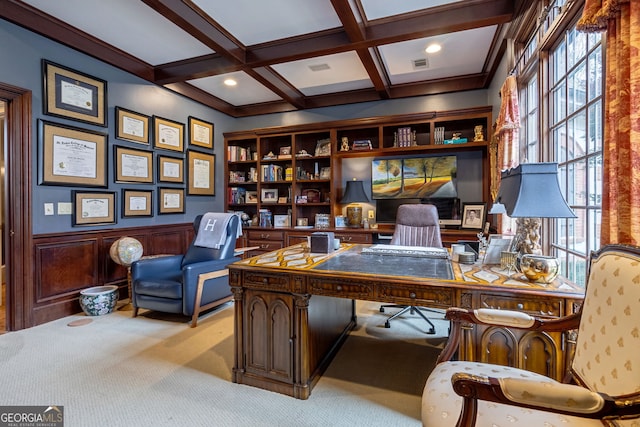 carpeted home office with a wealth of natural light, beamed ceiling, and coffered ceiling