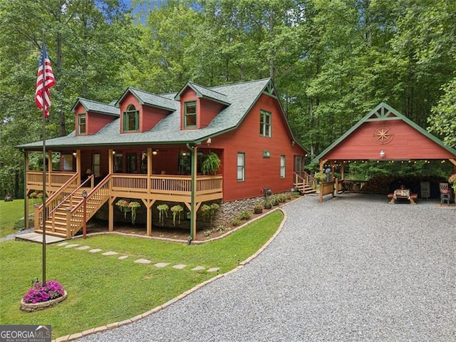 view of front of house with a front yard and a porch