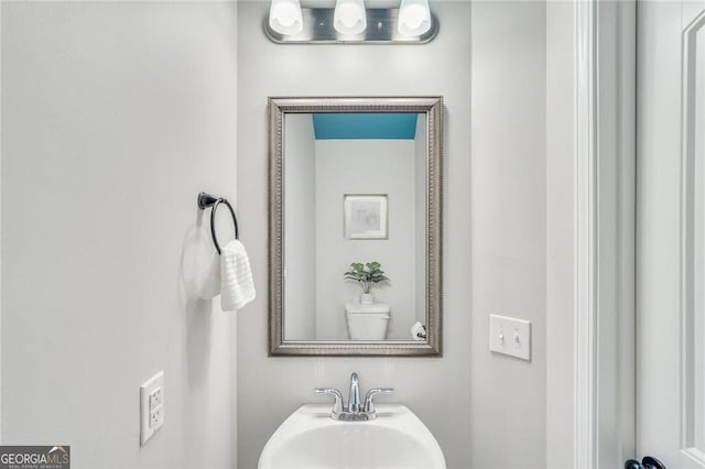 bathroom with toilet and sink