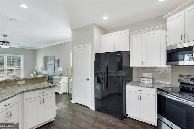 kitchen with white cabinets, ceiling fan, appliances with stainless steel finishes, and tasteful backsplash