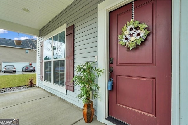 property entrance with covered porch