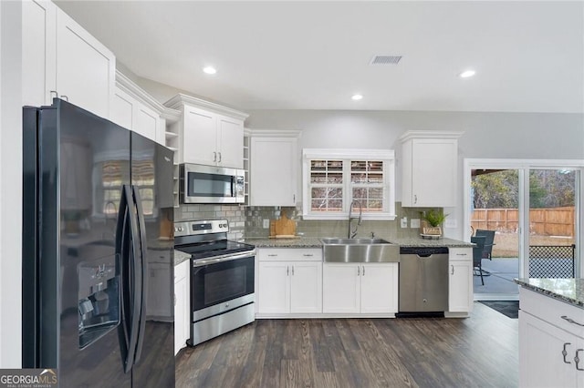 kitchen with white cabinets, sink, and appliances with stainless steel finishes