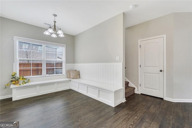 interior space with a chandelier and dark hardwood / wood-style flooring