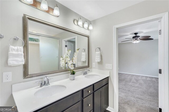 bathroom with ceiling fan and vanity