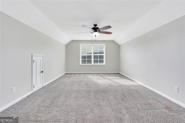 bonus room featuring carpet flooring, vaulted ceiling, and ceiling fan