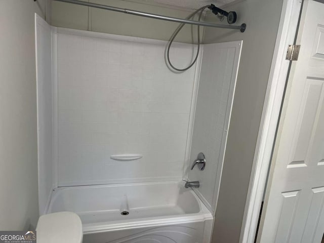 bathroom with washtub / shower combination