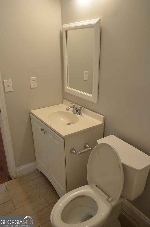 bathroom with vanity and toilet