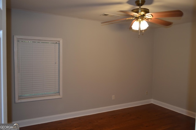 unfurnished room featuring ceiling fan and dark hardwood / wood-style flooring