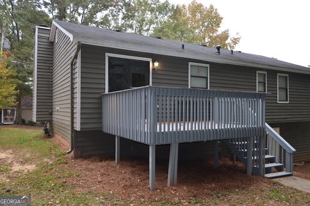 back of house featuring a wooden deck