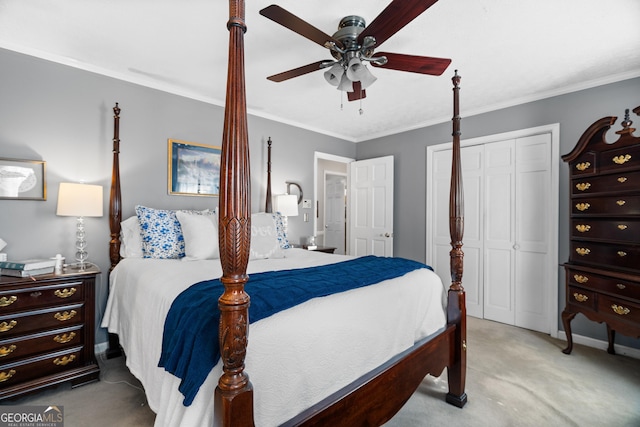 carpeted bedroom featuring a closet, ceiling fan, and crown molding