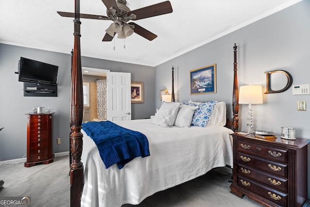 carpeted bedroom featuring ceiling fan and ornamental molding