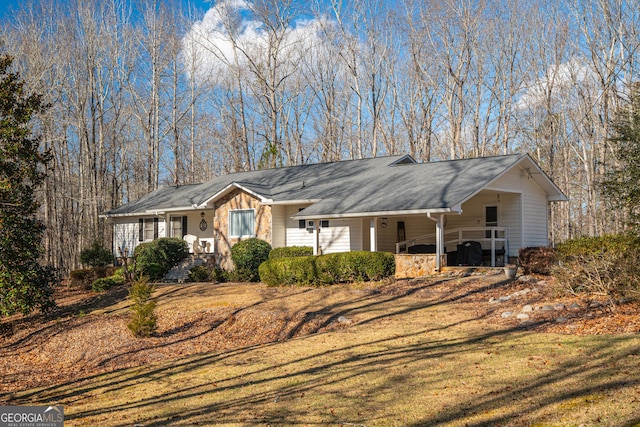 ranch-style house with a front lawn