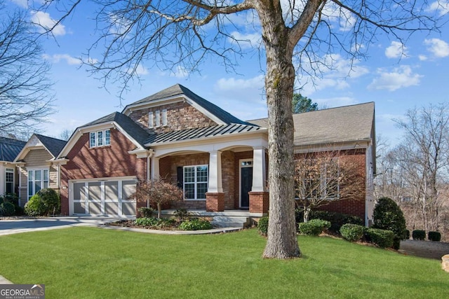 view of front of home with a garage and a front lawn