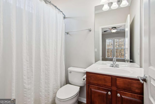 bathroom with ceiling fan, vanity, and toilet