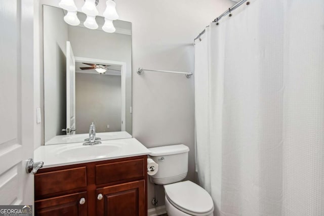 bathroom with vanity, toilet, and ceiling fan