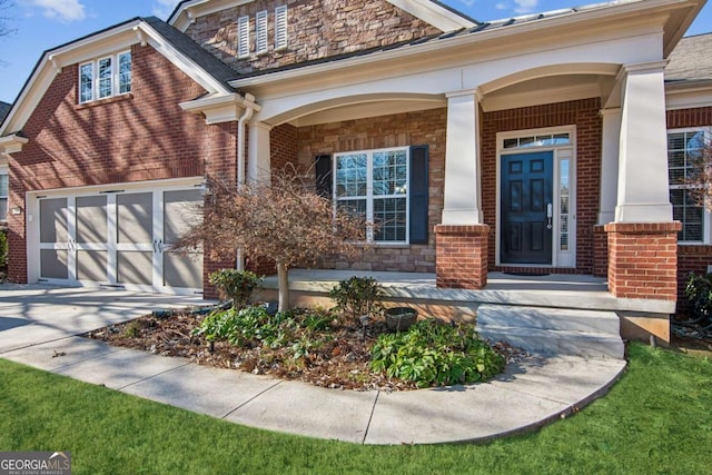 doorway to property featuring a porch and a garage