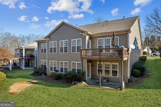 back of property with a lawn and a wooden deck