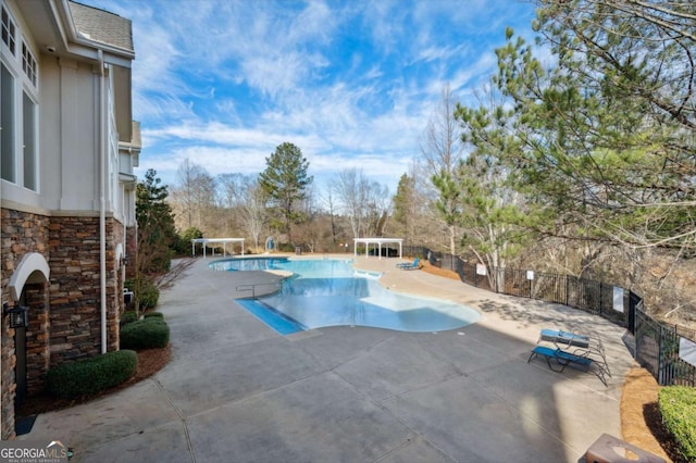 view of swimming pool featuring a patio