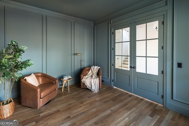 doorway to outside with dark wood-type flooring and french doors