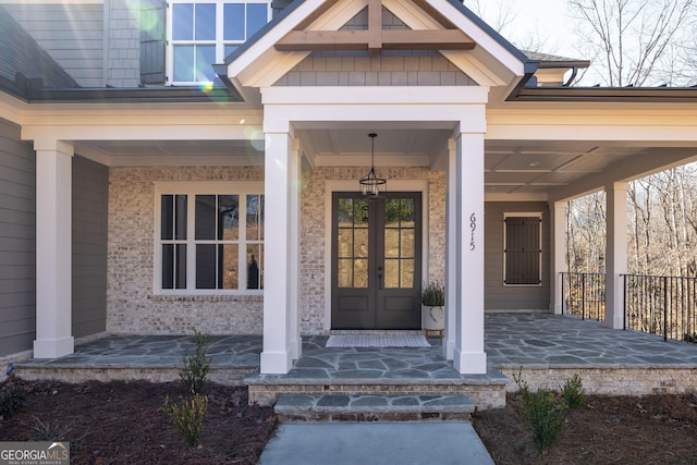 property entrance with french doors and covered porch