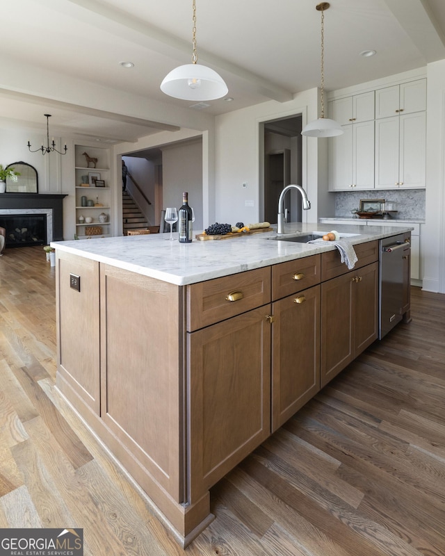 kitchen with white cabinetry, a large island, dishwasher, and hanging light fixtures